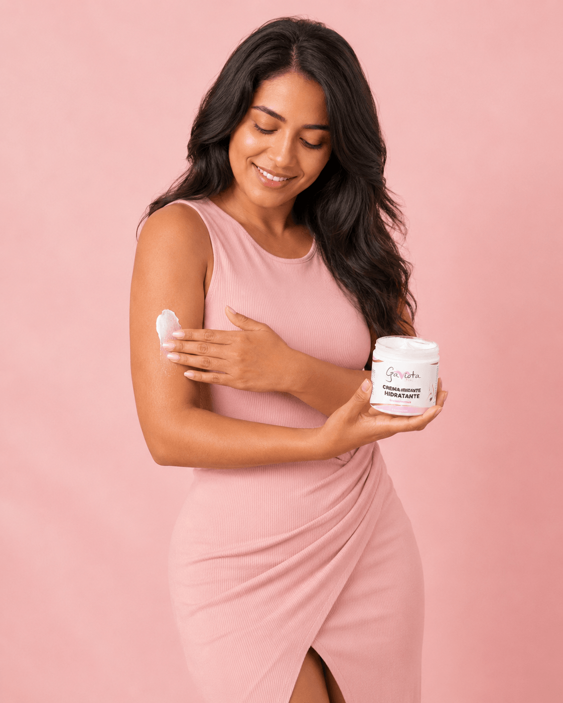 Woman applying Gaviota by Lia Hydrating Body Cream to her arm