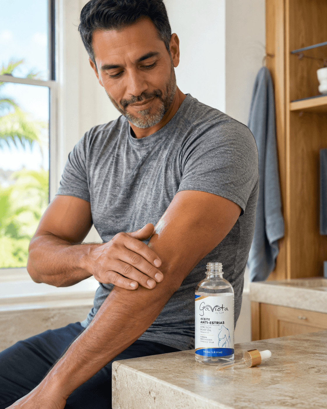 Man applying Gaviota by Lia Men's Stretch Mark Body Oil to his arm