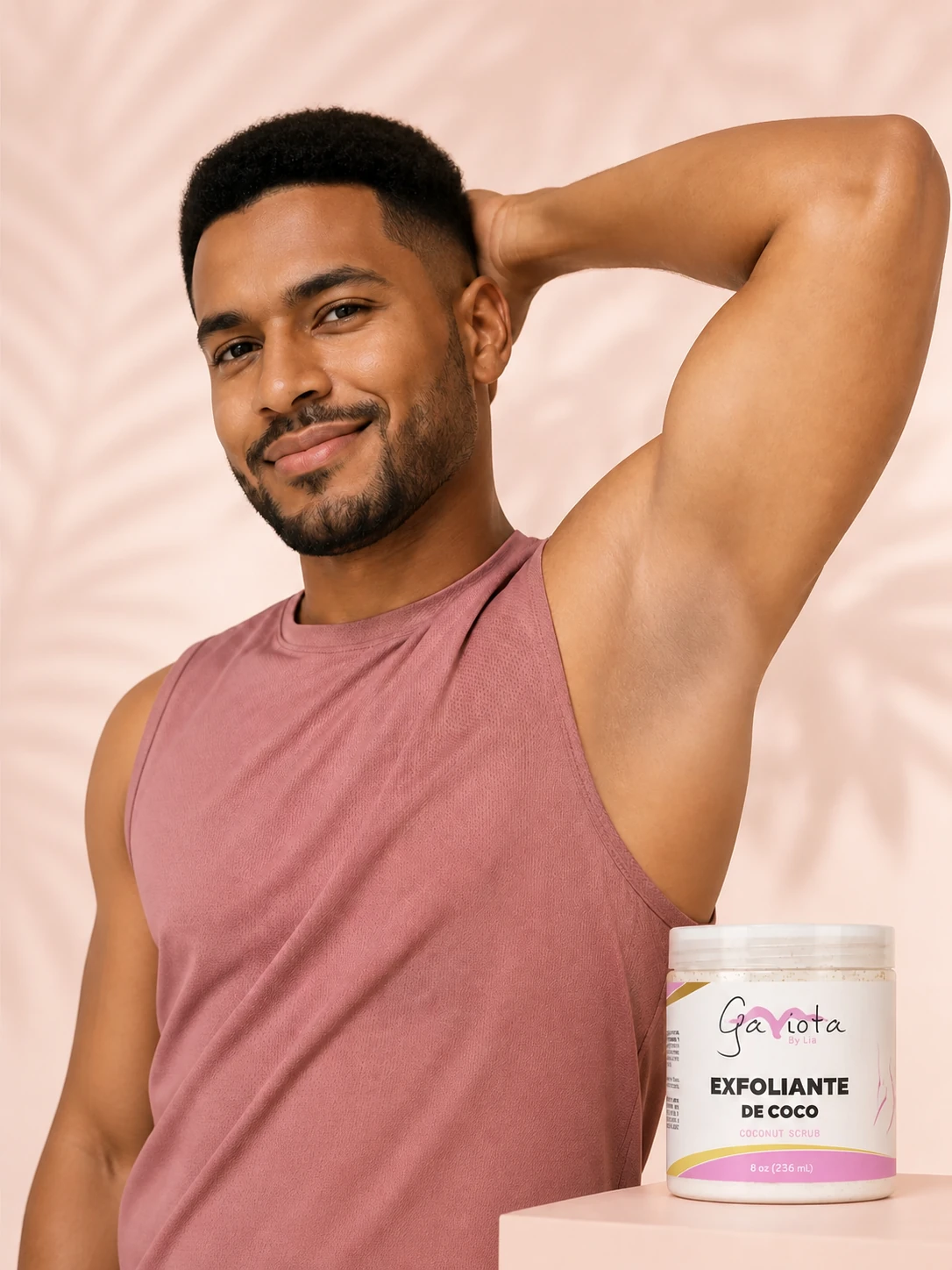 Man beside Gaviota by Lia Coconut Body Scrub in a warm pink body-care scene