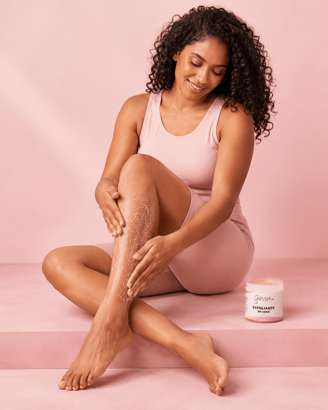 Woman applying Gaviota by Lia Coconut Body Scrub to her leg